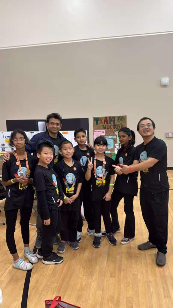 Students gathered together in matching STEM shirts