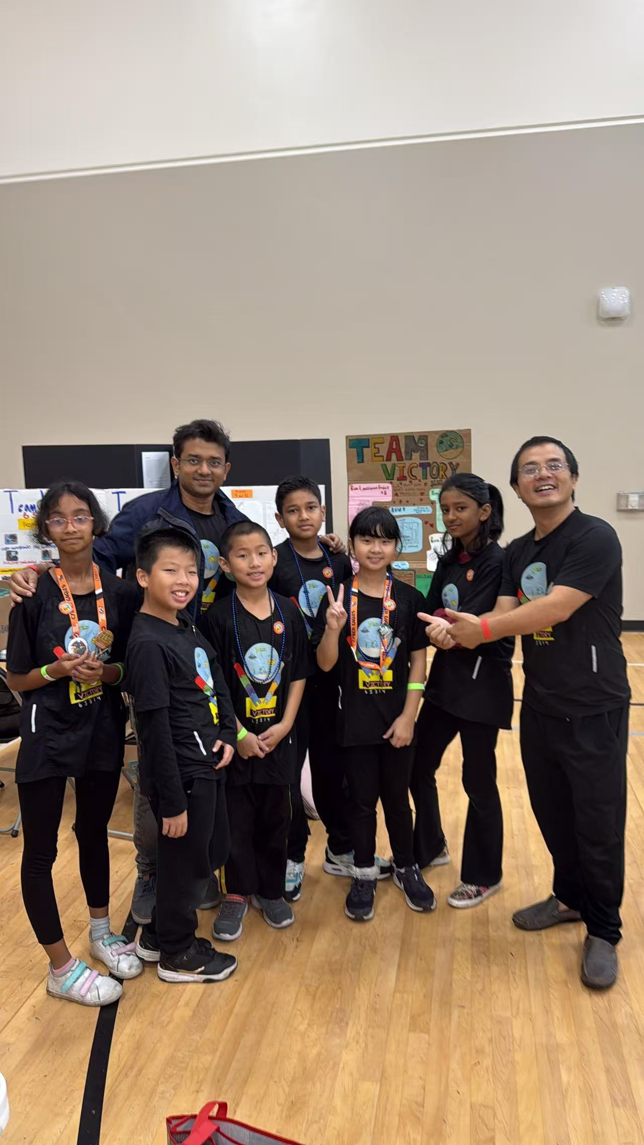 Students wearing matching STEM shirts at an indoor event