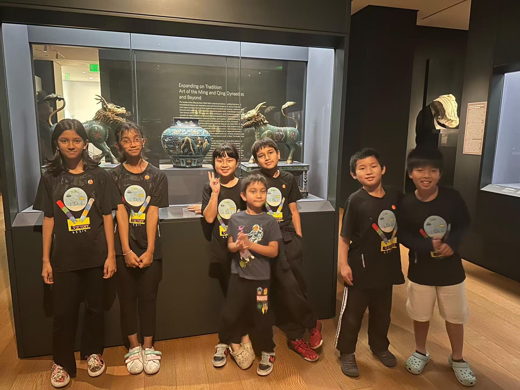 Students posing together during an educational museum visit