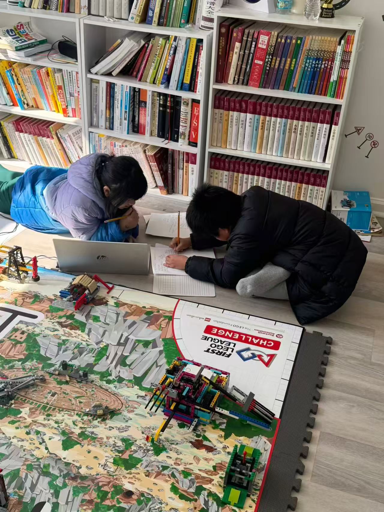Students studying a robotics field and STEM materials during a workshop